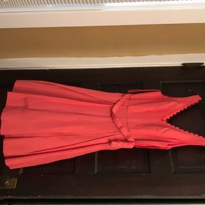 A never worn coral dress with bow detail size 2